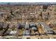 Wide aerial view of a residential neighborhood, highlighting rooftops and tree-lined streets at 432 N Ogden St, Denver, CO 80218