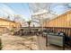 Relaxing deck with a dining table and outdoor seating, perfect for entertaining and enjoying the outdoors at 432 N Ogden St, Denver, CO 80218