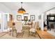 Bright dining room boasts an eclectic table, hardwood floors, and stylish accents at 432 N Ogden St, Denver, CO 80218