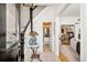 Bright foyer featuring stylish decor, a staircase, and a glimpse into adjacent living spaces at 432 N Ogden St, Denver, CO 80218