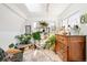 Sun room featuring multiple plants, skylight, large window, and bench seating at 432 N Ogden St, Denver, CO 80218