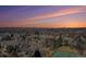 Sunset aerial view of the city skyline and surrounding neighborhoods, with mountains in the distance at 1900 E Girard Pl # 1103, Englewood, CO 80113