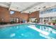 Indoor pool with ample seating, large windows, and inviting atmosphere at 1900 E Girard Pl # 1103, Englewood, CO 80113