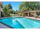 Sparkling outdoor pool with lounge chairs and covered seating areas at 1900 E Girard Pl # 1103, Englewood, CO 80113