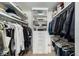 Organized walk-in closet with custom shelving and ample storage space for wardrobe and accessories at 1900 E Girard Pl # 1103, Englewood, CO 80113