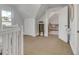 Bright attic space featuring carpet, a closet and a connecting doorway to another room at 748 Elati St, Denver, CO 80204