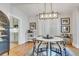 Elegant dining area featuring modern chandelier and seating for four at 748 Elati St, Denver, CO 80204