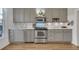 Modern kitchen with stainless steel appliances, white countertops, and ample cabinet space at 748 Elati St, Denver, CO 80204