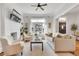 Inviting living room with large window, neutral tones, and hardwood flooring at 748 Elati St, Denver, CO 80204