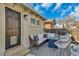 Cozy outdoor seating area on a deck, featuring comfortable furniture and a fire pit table at 748 Elati St, Denver, CO 80204