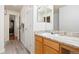 Charming bathroom featuring granite counters, vanity and views into the hallway at 3461 Maple Cir, Brighton, CO 80601