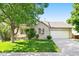 Charming single-Gathering home with a well-manicured lawn, brick facade, and attached two-car garage at 3461 Maple Cir, Brighton, CO 80601