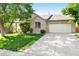 Charming brick home boasts a two-car garage, manicured lawn, and mature trees in a suburban setting at 3461 Maple Cir, Brighton, CO 80601