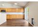 Well-equipped kitchen with stainless steel appliances, hardwood floors, ample cabinets, and a convenient sliding door to the deck at 3461 Maple Cir, Brighton, CO 80601
