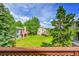 View of the backyard and other homes from a wood balcony at 766 Chimney Creek Dr, Golden, CO 80401