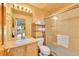 Bathroom features a modern sink, toilet, and shower with glass door and towel rack at 766 Chimney Creek Dr, Golden, CO 80401