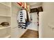 Walk-in closet provides ample storage with built-in shelves and hanging rods at 766 Chimney Creek Dr, Golden, CO 80401