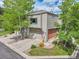 Charming two-story home with a two-car garage, inviting front yard, and mature shade trees at 766 Chimney Creek Dr, Golden, CO 80401