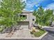 Inviting townhome with a two-car garage and charming curb appeal in a well-maintained neighborhood at 766 Chimney Creek Dr, Golden, CO 80401