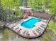 A picturesque pool featuring lounge seating with a serene waterfront view at 766 Chimney Creek Dr, Golden, CO 80401