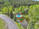 Aerial view of a community pool featuring blue water and lounge chairs near lush greenery at 766 Chimney Creek Dr, Golden, CO 80401