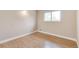 Inviting bedroom featuring hardwood floors and natural light at 3216 Revere St, Aurora, CO 80011