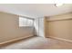 Bedroom with carpet, window, and closet at 3216 Revere St, Aurora, CO 80011