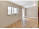 Cozy dining area with hardwood floors, a sliding glass door, and large windows at 3216 Revere St, Aurora, CO 80011