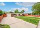 Charming single-story home with a well-manicured front lawn and long driveway at 3216 Revere St, Aurora, CO 80011