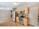 Bright kitchen featuring stainless steel appliances, light wood cabinets, and stylish tile backsplash at 3216 Revere St, Aurora, CO 80011