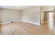 Spacious living room with pristine hardwood floors, neutral walls, and ample natural light, ready for personal touches at 3216 Revere St, Aurora, CO 80011