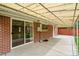 Covered patio with sliding glass door, offering seamless indoor-outdoor living at 3216 Revere St, Aurora, CO 80011
