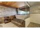 Bathroom featuring a soaking tub, wood accents and natural light at 5565 Osage Way, Larkspur, CO 80118