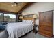Comfortable bedroom with wooden furniture and a view at 5565 Osage Way, Larkspur, CO 80118