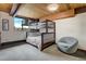 Cozy bedroom with bunk beds and a comfy lounge chair, perfect for a ' room at 5565 Osage Way, Larkspur, CO 80118