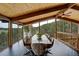 Bright dining room featuring a spacious table, chairs, and scenic views at 5565 Osage Way, Larkspur, CO 80118