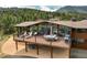 Enjoy outdoor living on this spacious deck, perfect for dining and relaxation at 5565 Osage Way, Larkspur, CO 80118