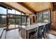 Open kitchen design with a large marble top breakfast bar and stunning backyard views at 5565 Osage Way, Larkspur, CO 80118