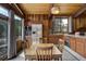 Inviting eat-in kitchen with stainless steel appliances, wood accents, and ample natural light at 5565 Osage Way, Larkspur, CO 80118