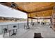 Enjoy the outdoors on this covered patio with lake views at 5565 Osage Way, Larkspur, CO 80118