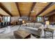 Spacious entertainment room with pool table, lounge area, and unique design elements at 5565 Osage Way, Larkspur, CO 80118