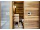 Private wood sauna for relaxation, featuring seating and a temperature control panel at 5565 Osage Way, Larkspur, CO 80118
