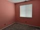 Cozy bedroom with a window bringing in natural light and neutral carpet flooring at 1216 S Flat Rock Cir, Aurora, CO 80018