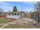 Backyard featuring a patio area and rock landscaping providing outdoor living space at 903 Poplar St, Denver, CO 80220