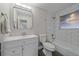 Updated bathroom with a modern vanity, subway tile shower, and neutral color palette at 903 Poplar St, Denver, CO 80220