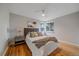 Comfortable bedroom with hardwood floors, natural light, and stylish decor for a relaxing retreat at 903 Poplar St, Denver, CO 80220