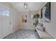 Stylish entryway featuring decorative tile flooring, modern lighting, and a comfortable bench at 903 Poplar St, Denver, CO 80220