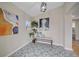 Inviting entryway with patterned tile, contemporary art, and bench seating, bright and airy at 903 Poplar St, Denver, CO 80220