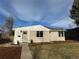 Charming single-story home featuring a well-maintained lawn and freshly painted exterior at 903 Poplar St, Denver, CO 80220