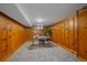 Cozy office space featuring wood paneled walls and carpet flooring for a warm feel at 903 Poplar St, Denver, CO 80220